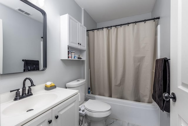 full bathroom featuring shower / bath combo with shower curtain, toilet, and vanity