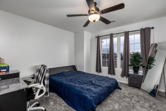 bedroom featuring ceiling fan and carpet