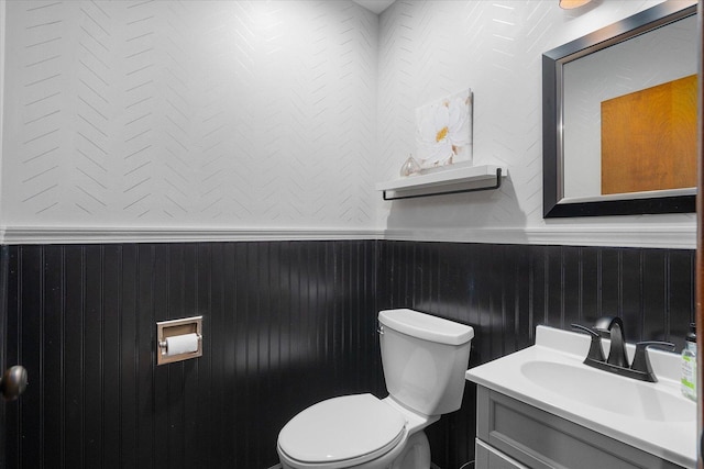 bathroom with toilet and vanity