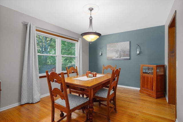 dining space with light wood-type flooring