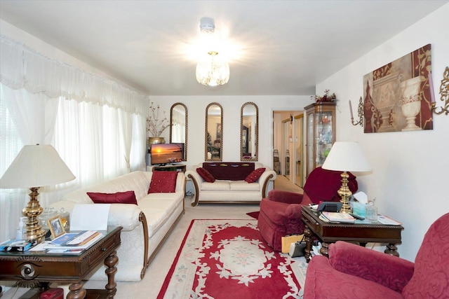 living room with a notable chandelier