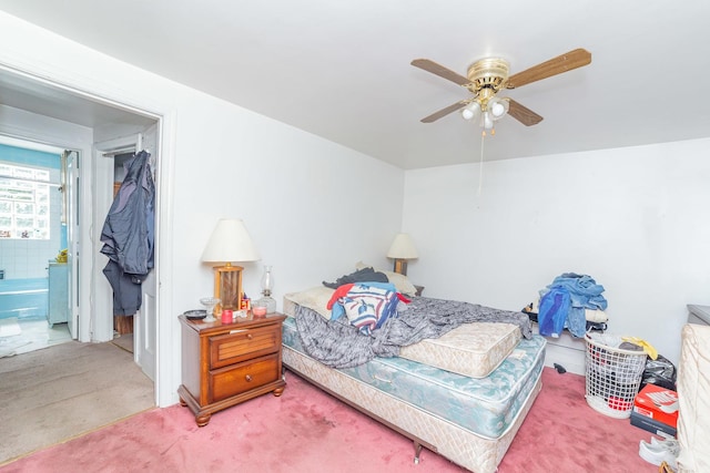 bedroom featuring ceiling fan, connected bathroom, and carpet flooring