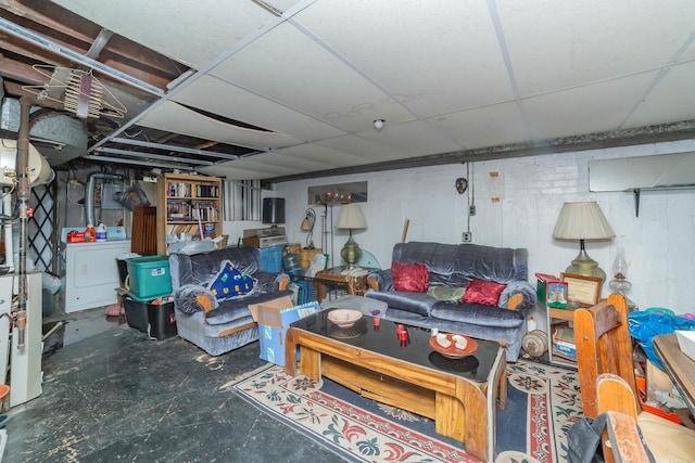 basement with washer / dryer and a paneled ceiling