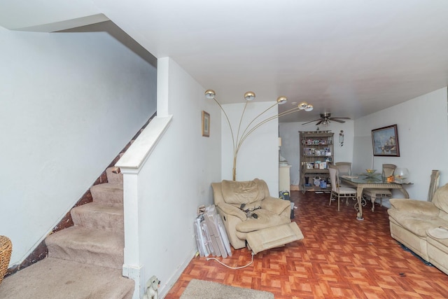 living room with parquet floors and ceiling fan