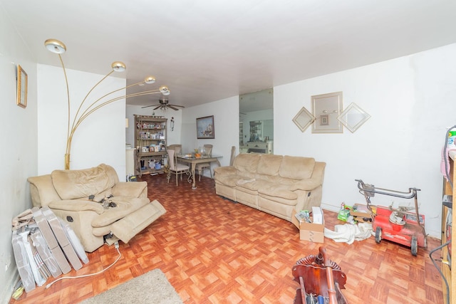 living room featuring parquet floors and ceiling fan