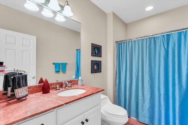 bathroom featuring tile patterned floors, toilet, and vanity