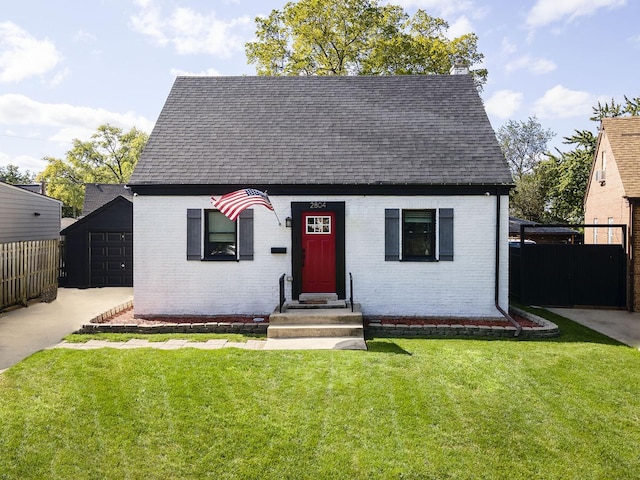 view of front of home with a garage and a front yard