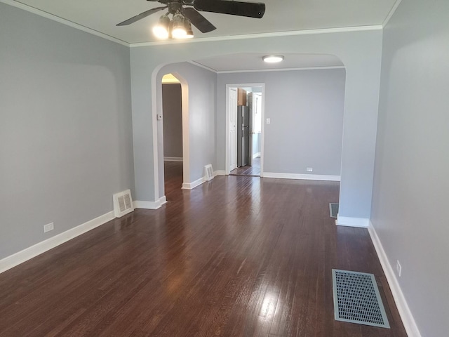 unfurnished room with ceiling fan, crown molding, and dark hardwood / wood-style flooring