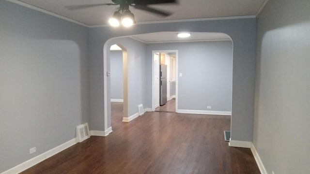 unfurnished room with dark wood-type flooring, ornamental molding, and ceiling fan