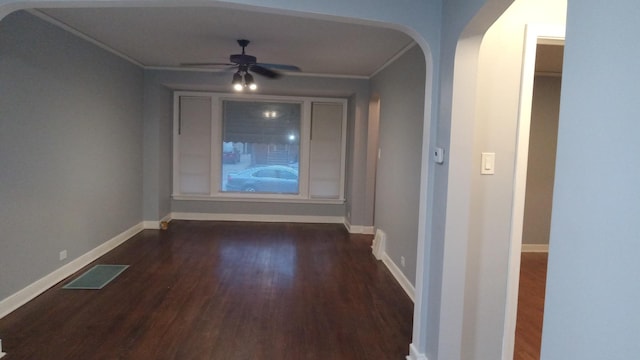 hall with ornamental molding and dark hardwood / wood-style floors