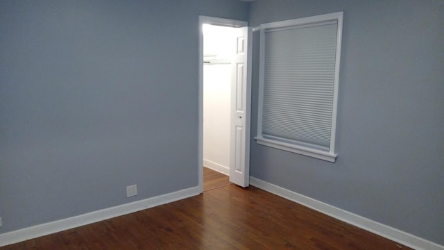 empty room featuring dark hardwood / wood-style floors