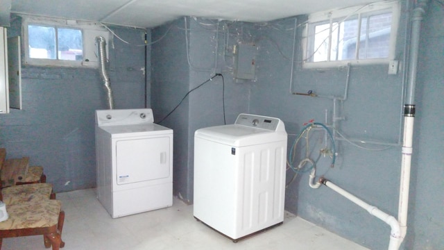 washroom featuring washing machine and dryer and electric panel