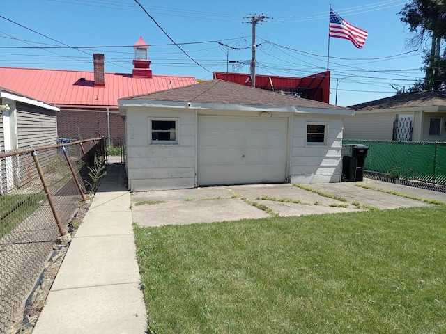 garage featuring a yard