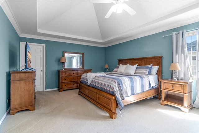 carpeted bedroom with lofted ceiling, crown molding, a tray ceiling, and ceiling fan