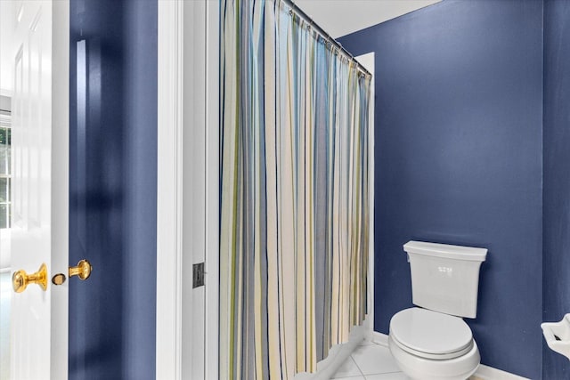 bathroom featuring tile patterned flooring and toilet