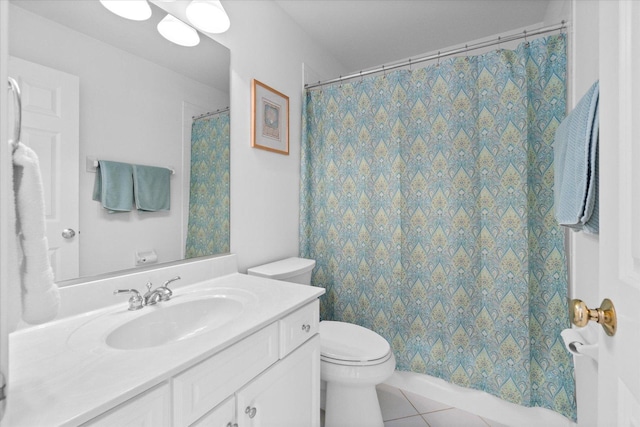 bathroom featuring tile patterned flooring, vanity, and toilet