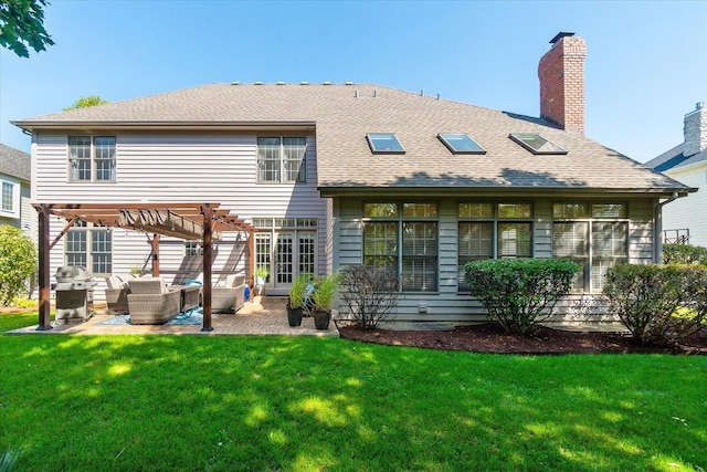 rear view of property with an outdoor living space, a pergola, a patio area, and a lawn