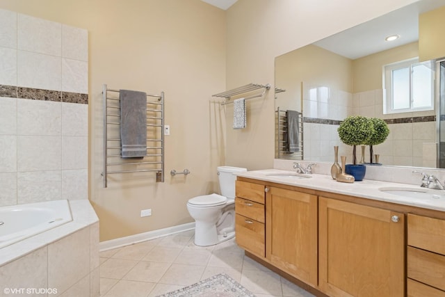 bathroom featuring radiator heating unit, tiled bath, tile patterned flooring, vanity, and toilet