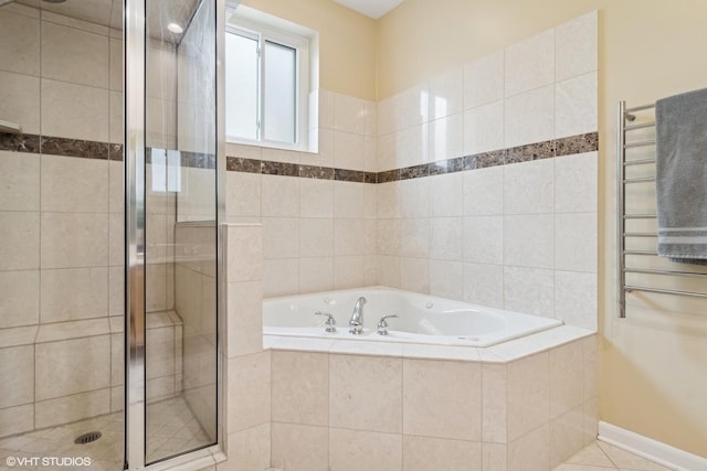 bathroom featuring tile patterned floors, independent shower and bath, and radiator heating unit