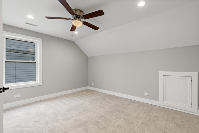 bonus room featuring ceiling fan, light carpet, and lofted ceiling