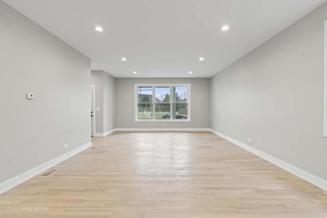 spare room with light hardwood / wood-style floors