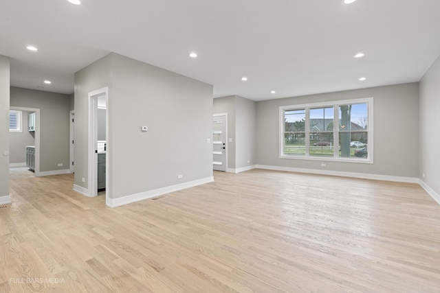 unfurnished living room featuring light hardwood / wood-style flooring