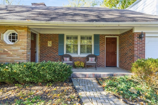 view of exterior entry with a porch