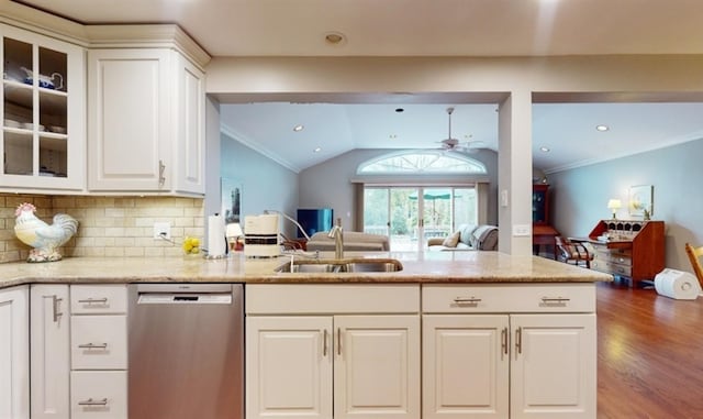 kitchen featuring hardwood / wood-style floors, sink, light stone counters, dishwasher, and white cabinets