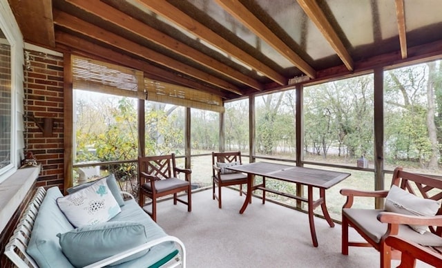 sunroom with beam ceiling