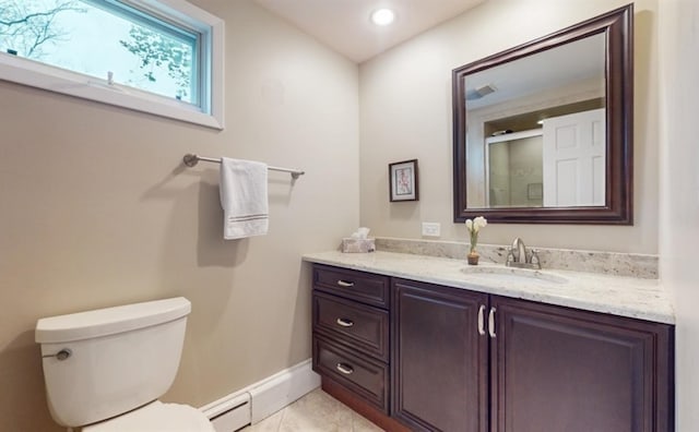 bathroom with toilet, tile patterned floors, and vanity