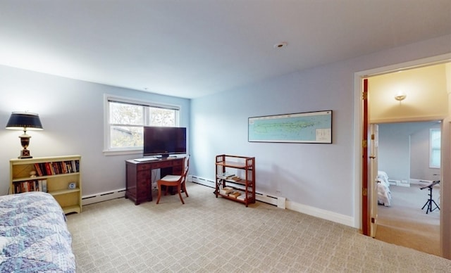 bedroom with baseboard heating and light colored carpet