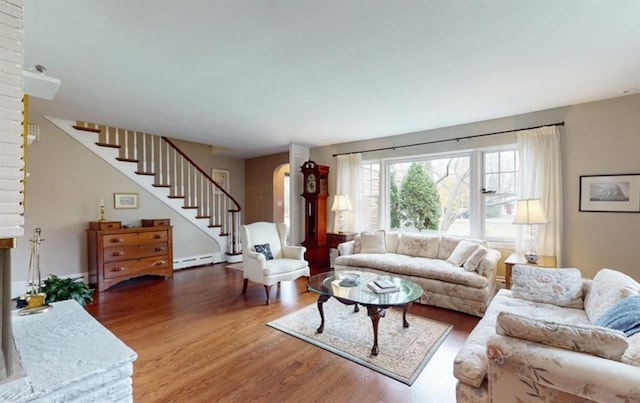 living room featuring hardwood / wood-style floors and baseboard heating