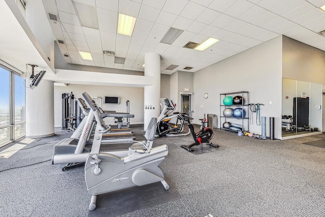 workout area featuring a drop ceiling