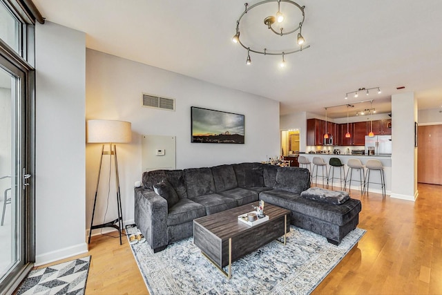 living room with light hardwood / wood-style flooring