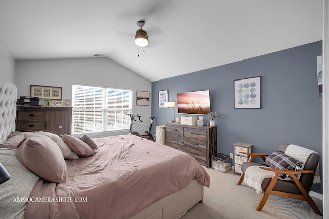 carpeted bedroom featuring ceiling fan and lofted ceiling