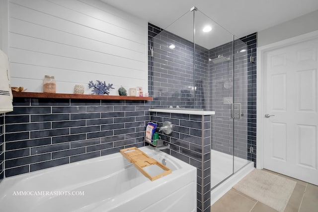 bathroom featuring tile patterned floors and plus walk in shower