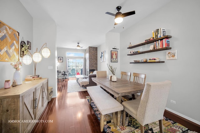 dining room with dark hardwood / wood-style floors and ceiling fan