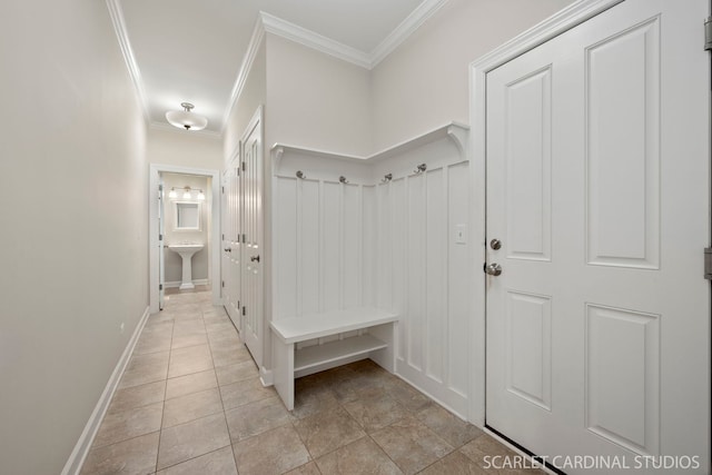 mudroom featuring crown molding and light tile patterned floors