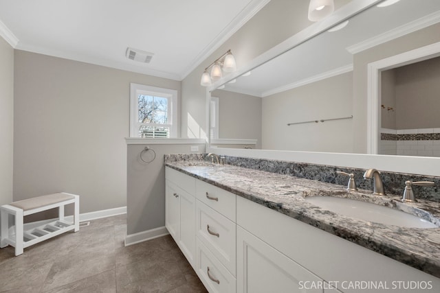 bathroom featuring ornamental molding and vanity