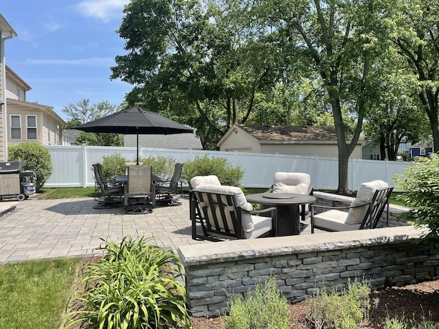 view of patio featuring a fire pit