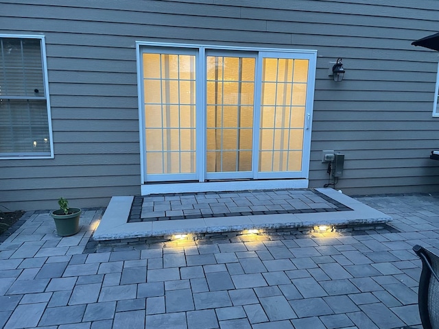 property entrance with a patio area