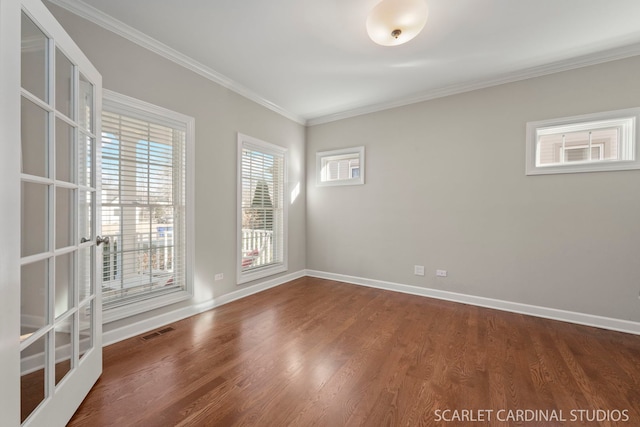 unfurnished room featuring ornamental molding and wood-type flooring