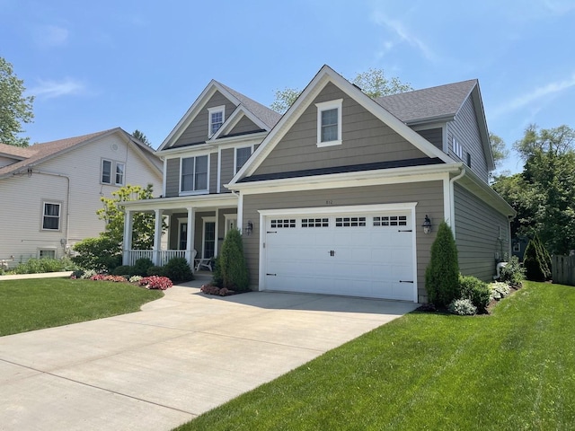 craftsman inspired home with a porch, a garage, and a front lawn