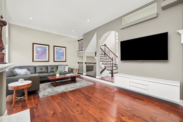 living room featuring hardwood / wood-style flooring and ornamental molding