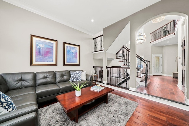 living room with hardwood / wood-style flooring and ornamental molding