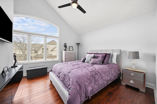 bedroom with dark wood-type flooring, ceiling fan, and vaulted ceiling