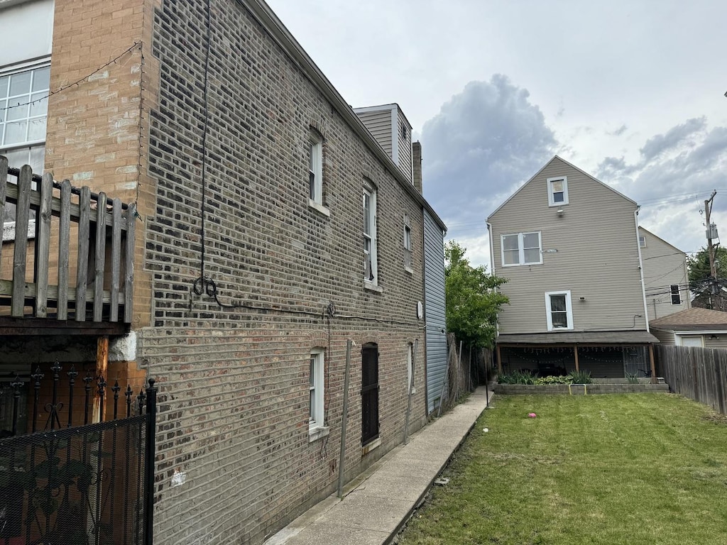 view of home's exterior with a yard