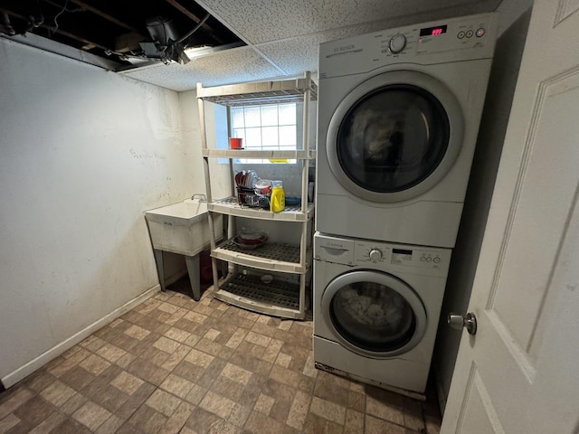 washroom with stacked washer / drying machine