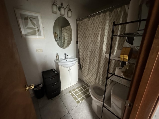 bathroom featuring toilet, tile patterned flooring, a shower with shower curtain, and vanity