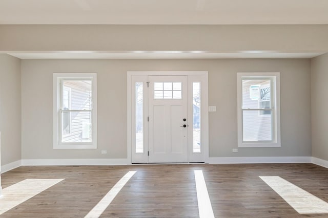 entryway with hardwood / wood-style flooring